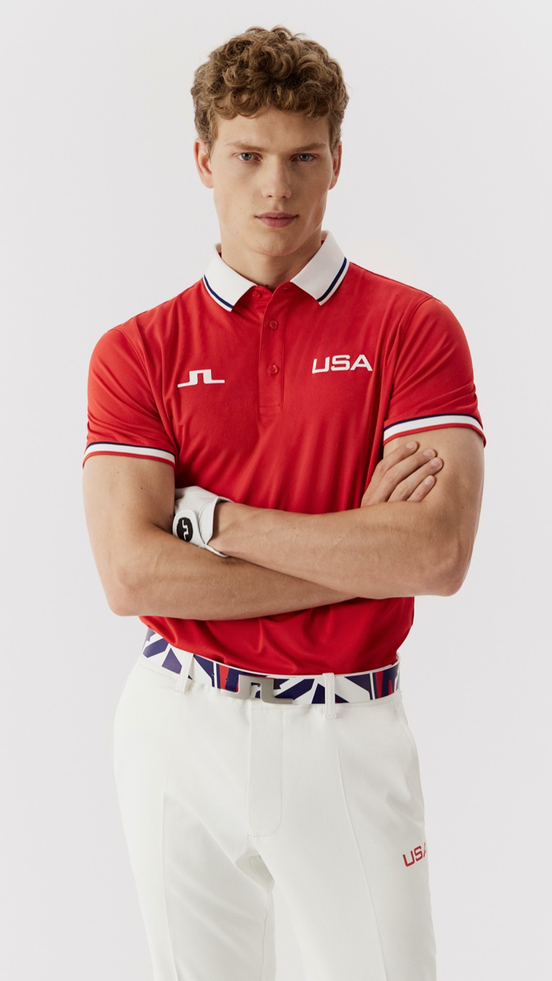 The U.S. Olympic golf team kicks off in a striking red polo paired with crisp white trousers by J.Lindeberg.