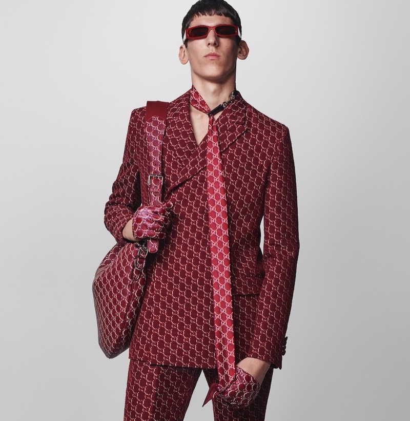 Martin Miller rocks a bold patterned GG suit in rich burgundy for Gucci's fall-winter 2024 campaign. 