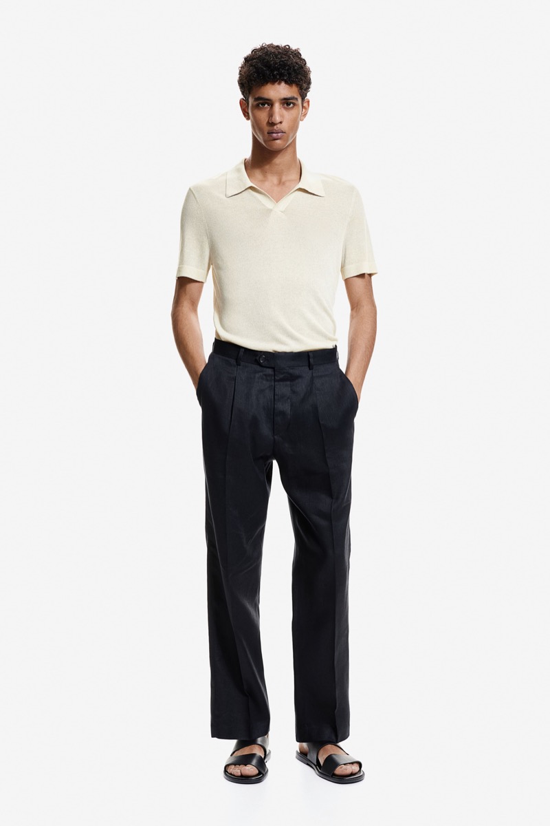 Model Abas Abdirazaq sports H&M's glittery polo shirt and relaxed-fit pants. 