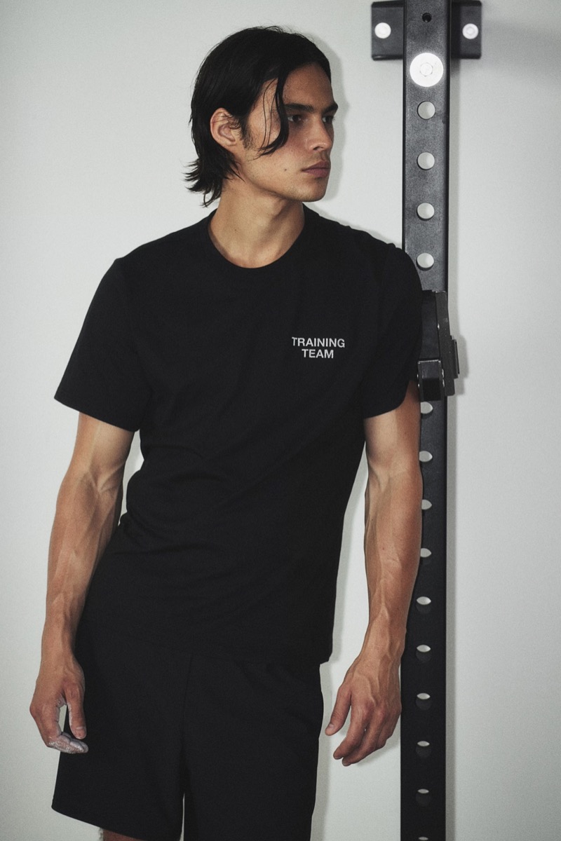 Louis Baines models an H&M DryMove T-shirt and 2-in-1 sports shorts. 