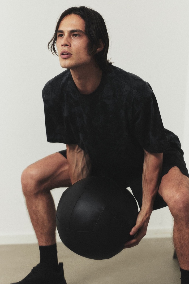 H&M enlists Louis Baines to model one of its DryMove T-shirts with sports shorts. 