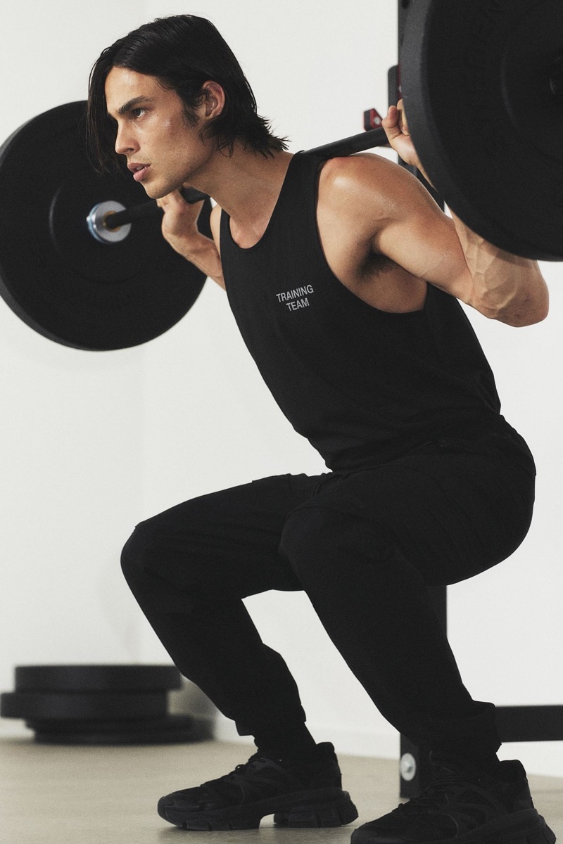 Sporting a "Training Team" tank, Louis Baines also rocks H&M's sports cargo joggers.