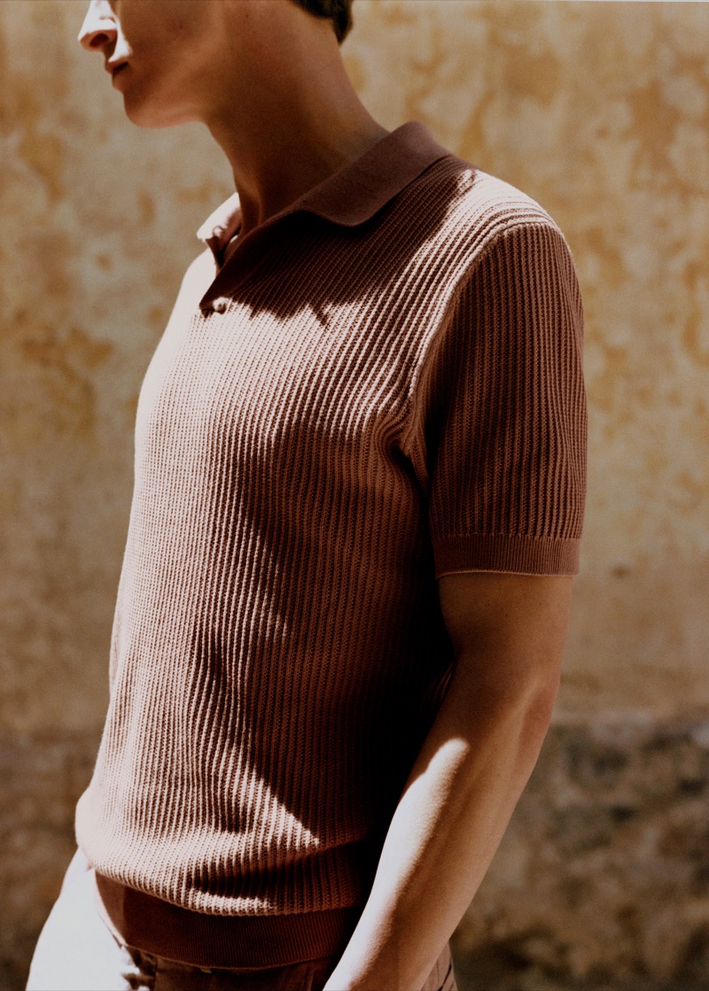 Tim Schuhmacher wears a ribbed knit polo from Mango's summer 2024 collection. 