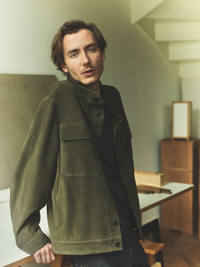 Model Paul Hameline embraces smart style in a Massimo Dutti olive green suede jacket.