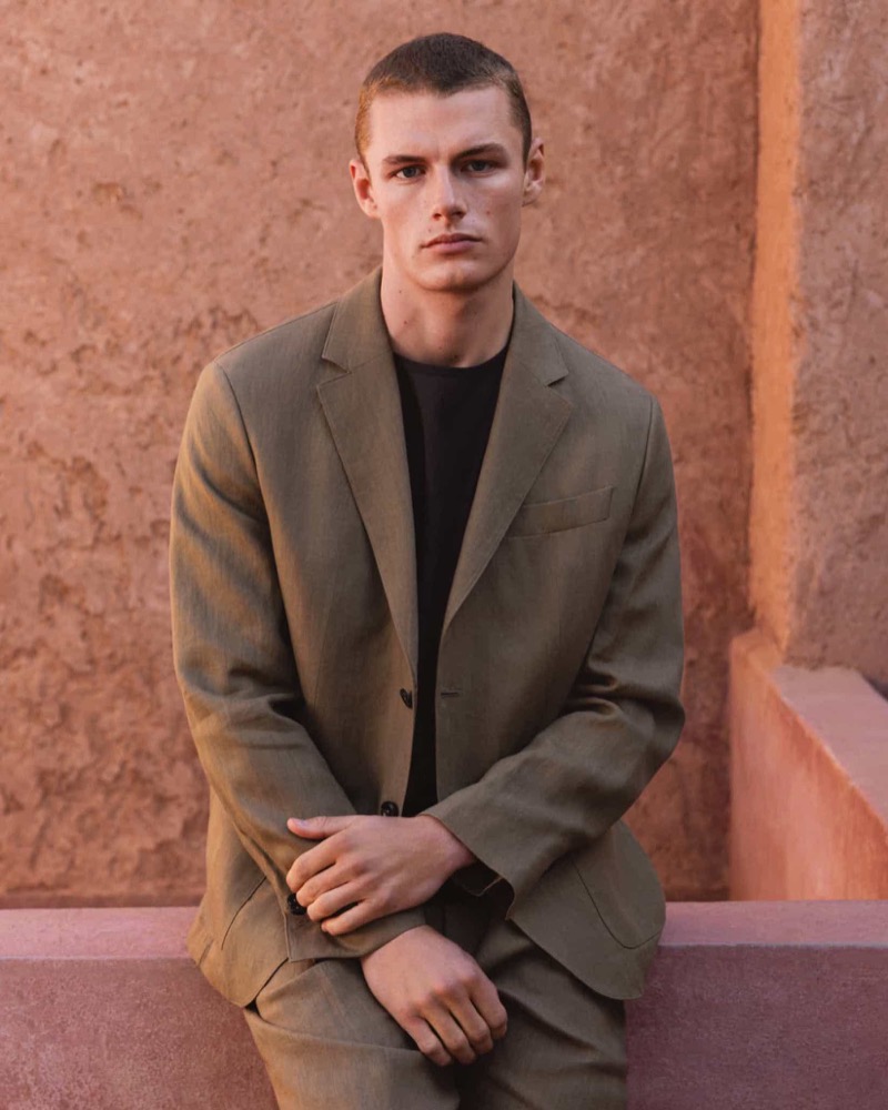 Massimo Dutti enlists Finley Prentice to showcase its summer collection, highlighting an olive-green suit paired with a black tee.