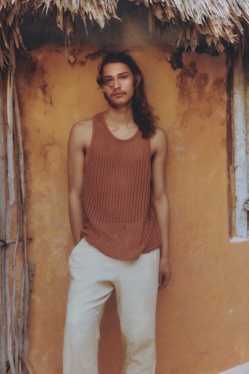 Model Hudson Primo dons a rust-colored crochet tank and linen pants, perfectly embodying Primark's summer 2024 aesthetic.