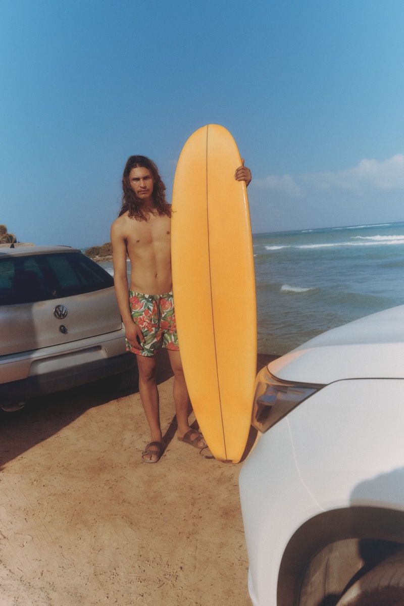 Ready to surf, Hudson Primo wears tropical print swim trunks from Primark.