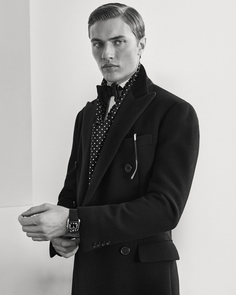 A polished watch and a poised stance complete Lucky Blue Smith’s look, emphasizing the meticulous details of Ralph Lauren Purple Label. 