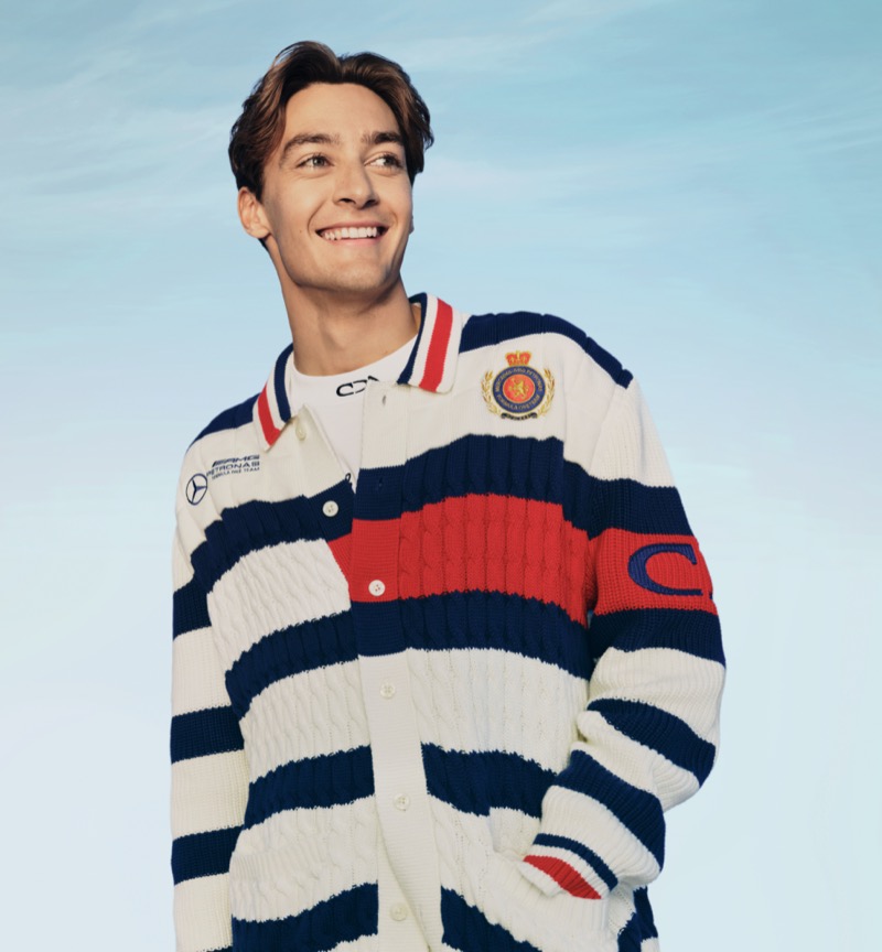 George Russell showcases the bold stripes of the Tommy Hilfiger x Mercedes AMG Petronas F1 x Clarence Ruth knitwear. 