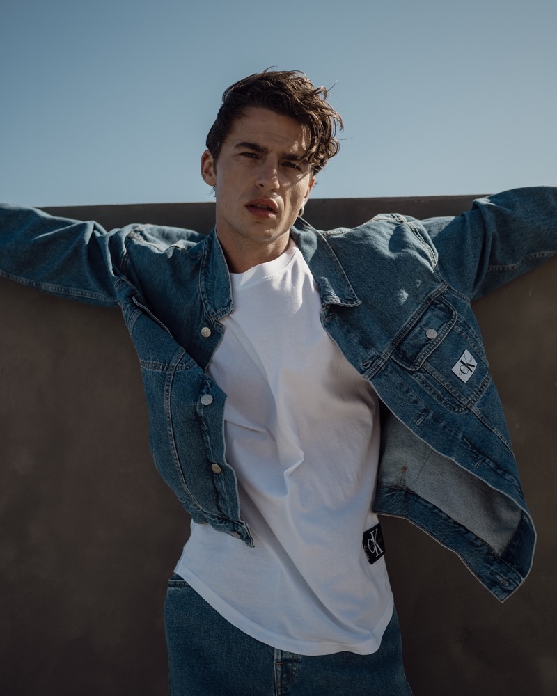 Yulef Bopp captures a timeless look with a Calvin Klein denim jacket and white tee. 