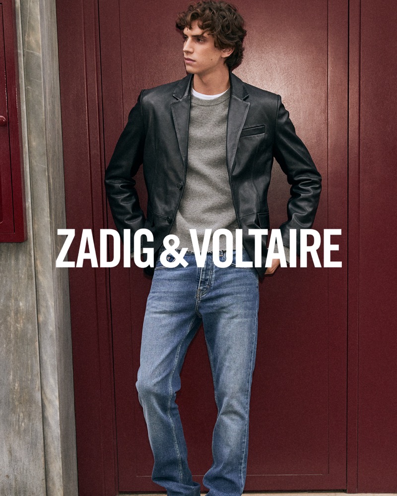 Hedi Ben Tekaya stands confidently in a leather blazer and casual jeans from Zadig & Voltaire's spring-summer 2024 collection.