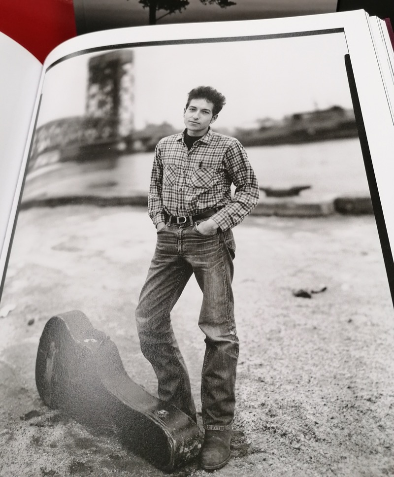 An early 1960s photo of Bob Dylan showcases his humble style rooted in denim and flannel.