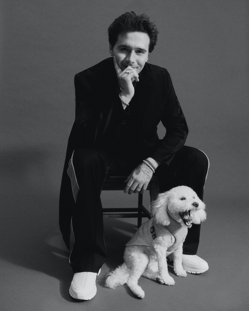 Sitting with one of his many dogs, Lamb, Brooklyn Beckham wears a look by Diesel.