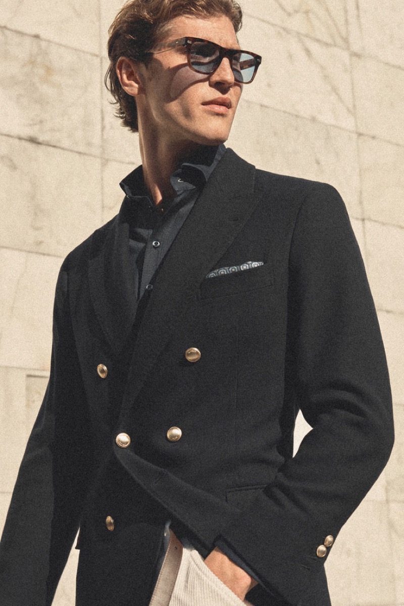 Donning a double-breasted blazer, Jacques Saayman wears Brunello Cucinelli.