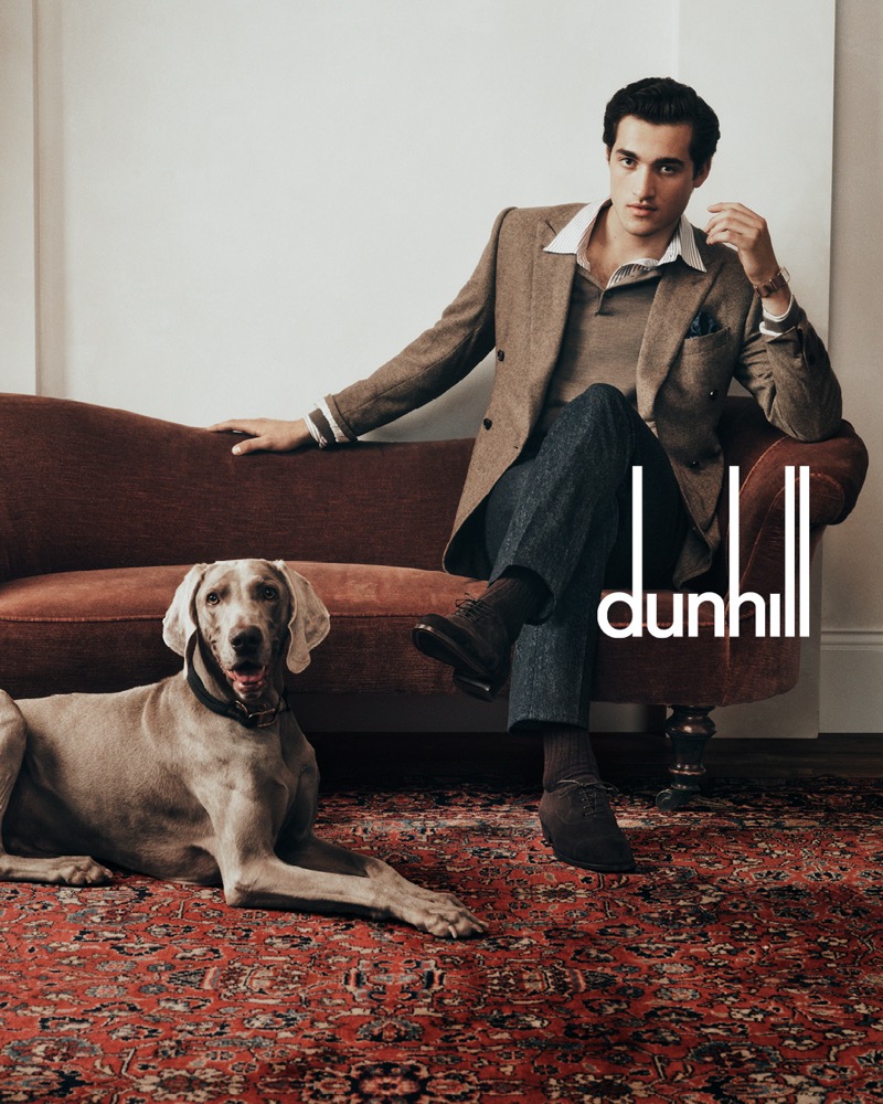 Adam Sattrup epitomizes elegance in Dunhill’s fall-winter 2024 campaign, wearing a classic tweed blazer and posing with a Weimaraner.