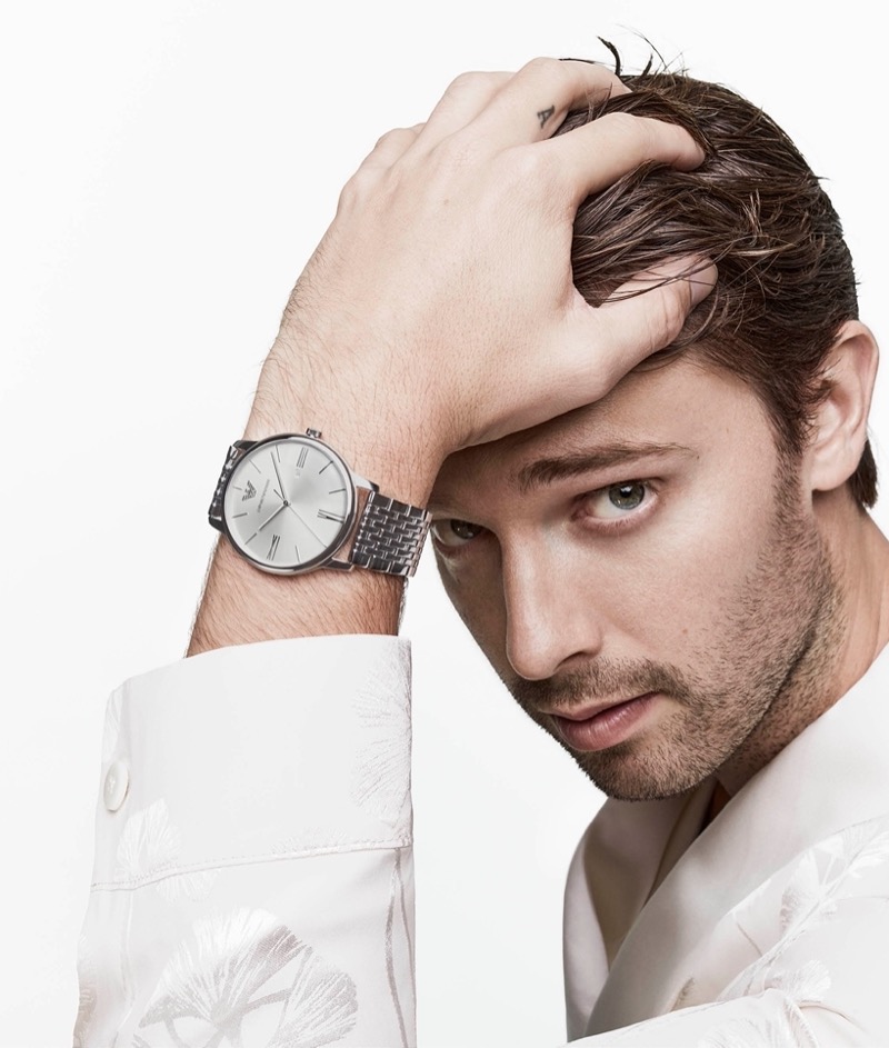 Emporio Armani enlists Patrick Schwarzenegger as the star of its summer 2024 accessories campaign, featuring a stainless steel watch.