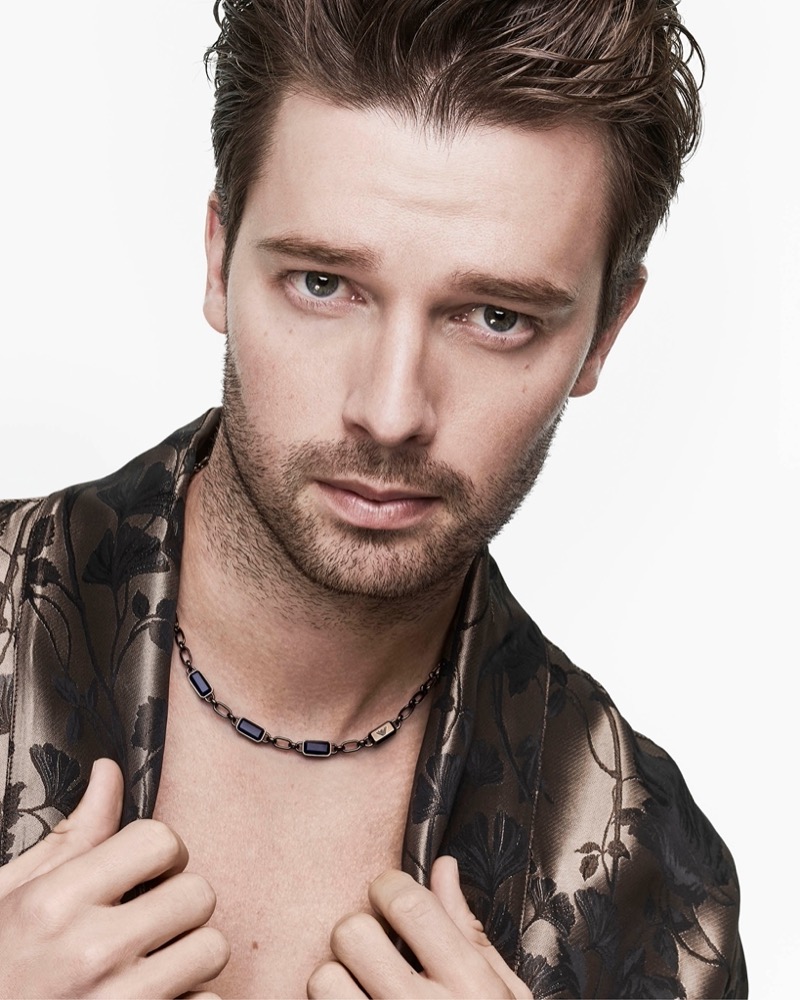 Actor Patrick Schwarzenegger wears a blue stone chain necklace for Emporio Armani’s summer 2024 accessories campaign.