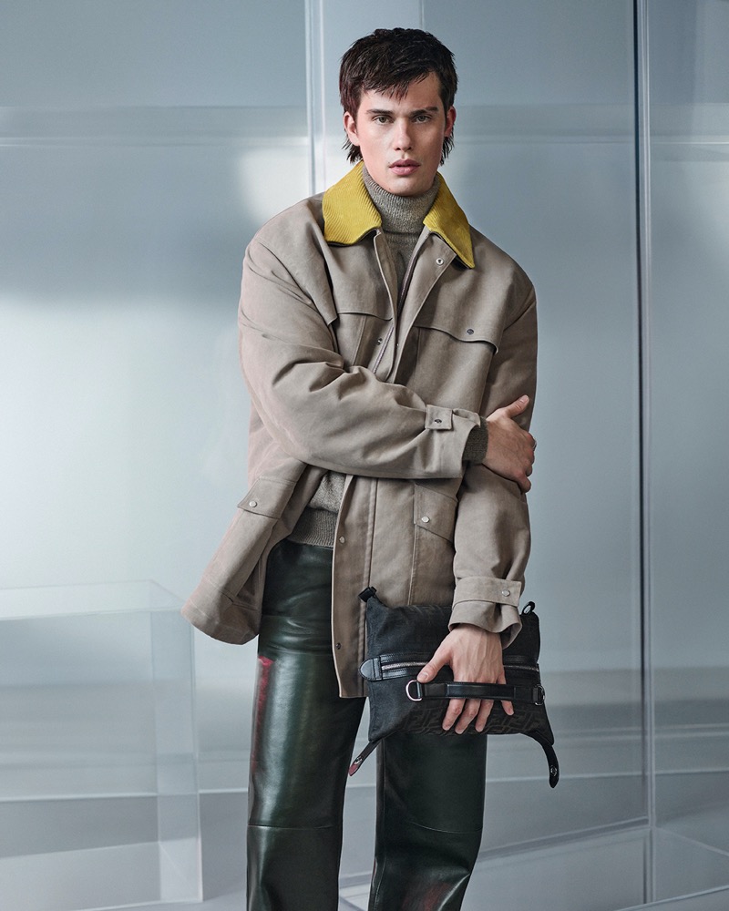 Embracing layered textures, Nicholas Galitzine showcases a rugged jacket with a pop of yellow and leather trousers for Fendi’s fall-winter 2024 advertisement. 