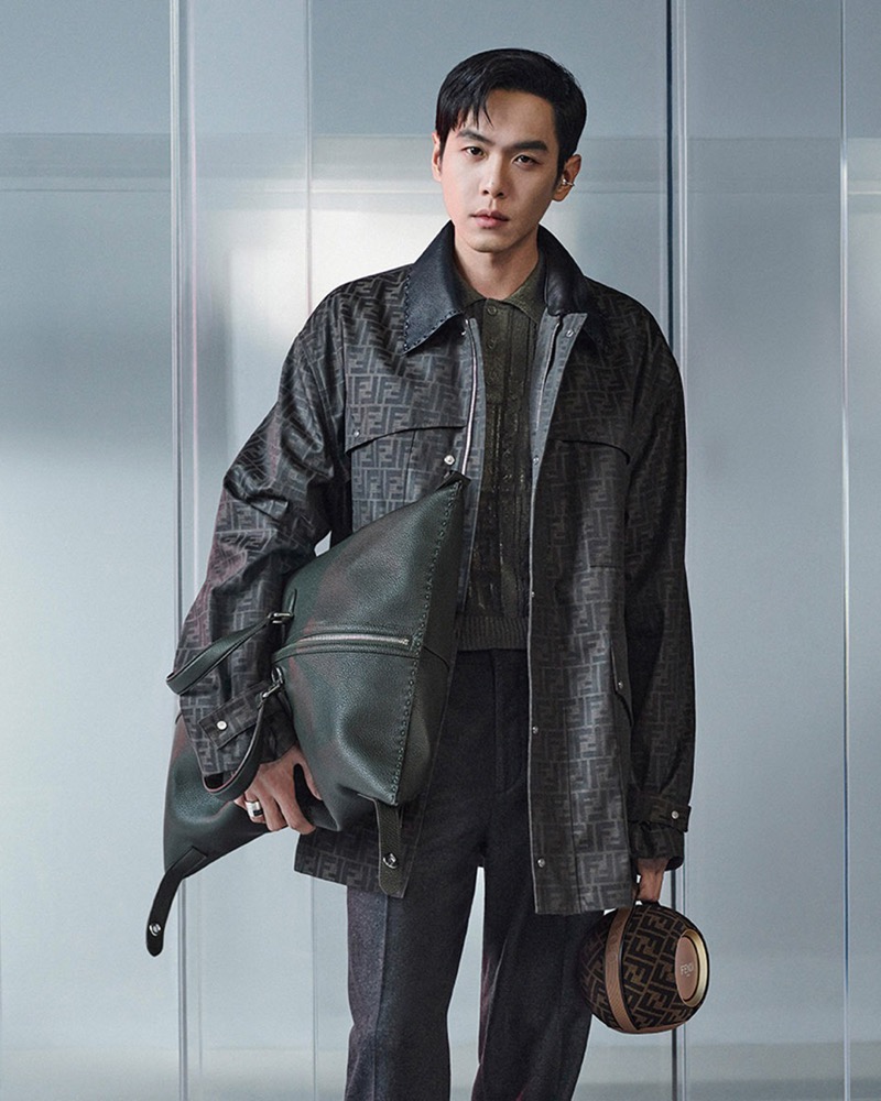 Zhang Ruoyun makes a statement in an FF logo jacket and pleated trousers, complete with Fendi’s signature bags for the brand’s fall-winter 2024 campaign.