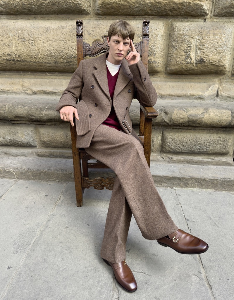 Tim Schuhmacher dons a double-breasted suit for the Ferragamo in Florence campaign, captured at Piazza Santa Trinita. 