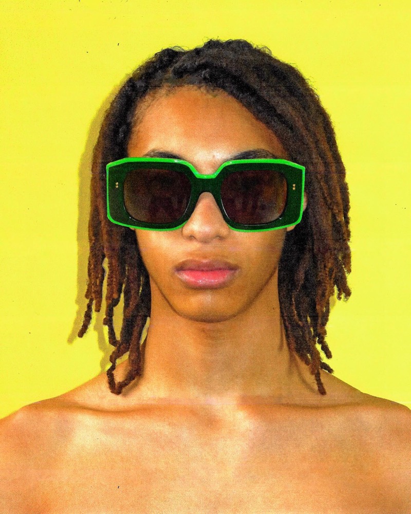 Malik Derdak rocks JW Anderson’s khaki and lime-green Bumper sunglasses.