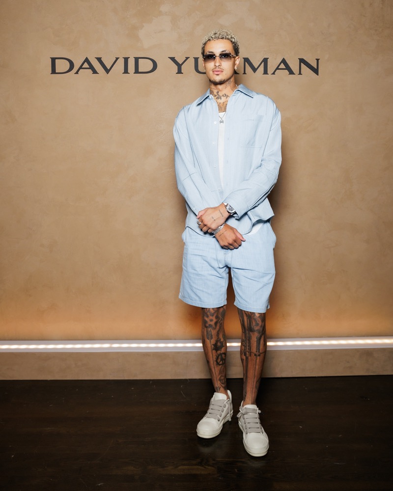 NBA forward and David Yurman ambassador Kyle Kuzma stands out in a light blue shirt and shorts set. 