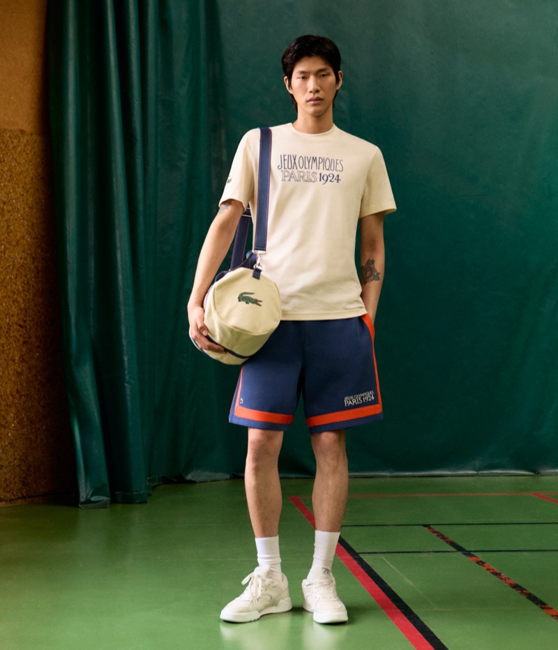Sanggun Lee wears a t-shirt and shorts from the Lacoste Heritage Paris 1924 collection.