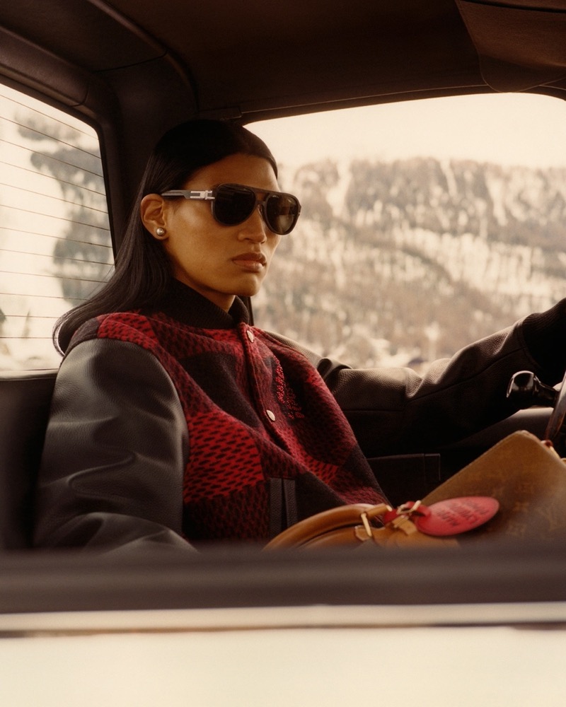 Riding through snowy mountains, Kyosuke Akiyoshi sports a chic red and black jacket for the Louis Vuitton fall-winter 2024 campaign.