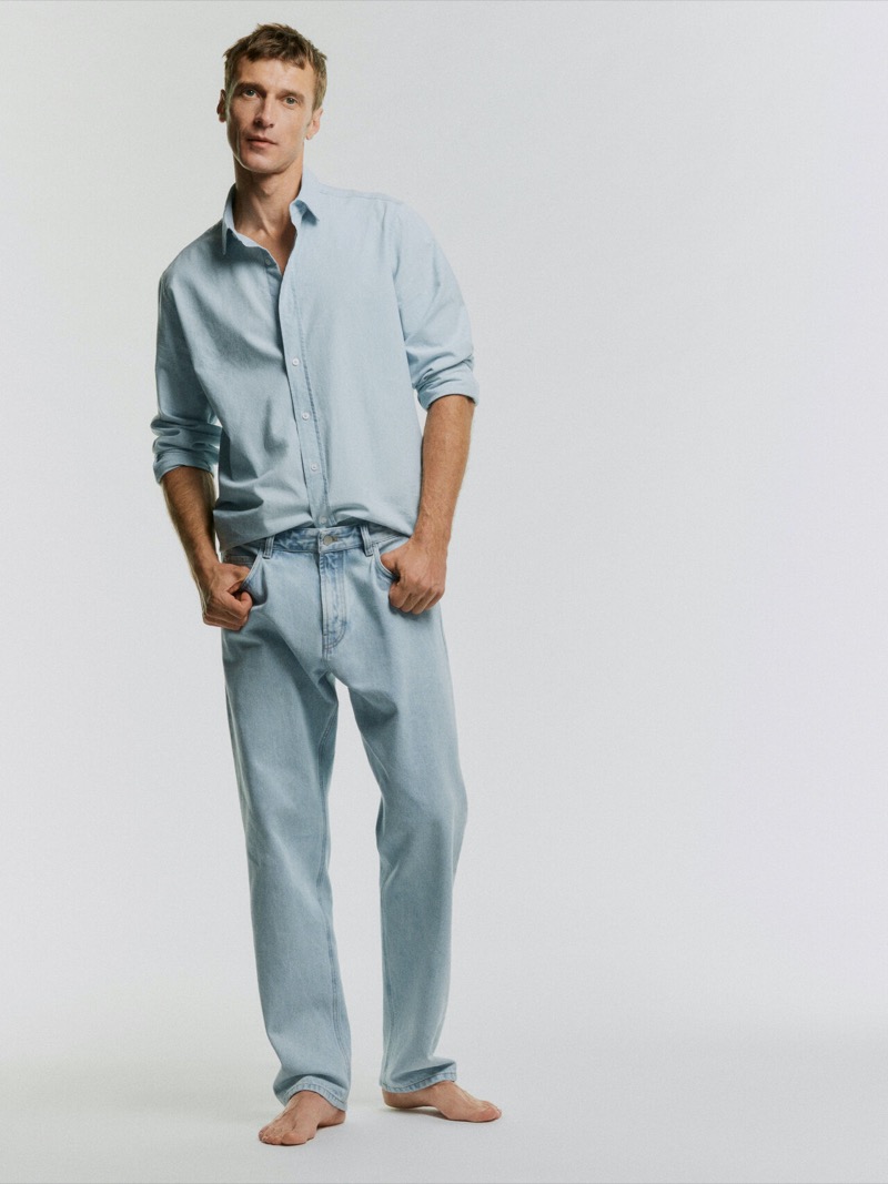 Clément Chabernaud, in a light blue ensemble, models a chic take on denim from Massimo Dutti’s summer 2024 line.