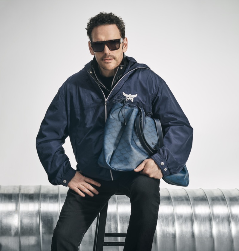 Actor Matt Dillon sports a windbreaker for MCM’s fall-winter 2024 advertisement featuring its Himmel drawstring tote.