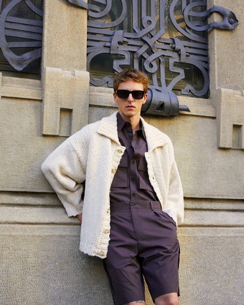 Quentin Demeester stands out in an oversized Commas cardigan over a look by LOEWE and Dolce & Gabbana.