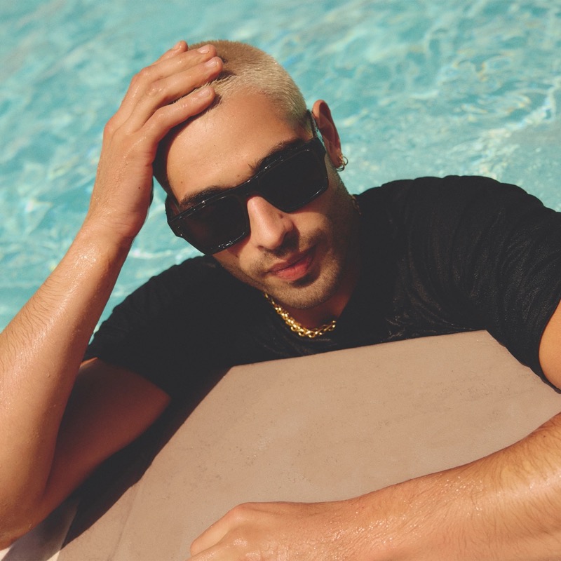 Lounging by the pool, Evan Leff makes a splash in Quay’s Fast Lane Black Smoke sunglasses.