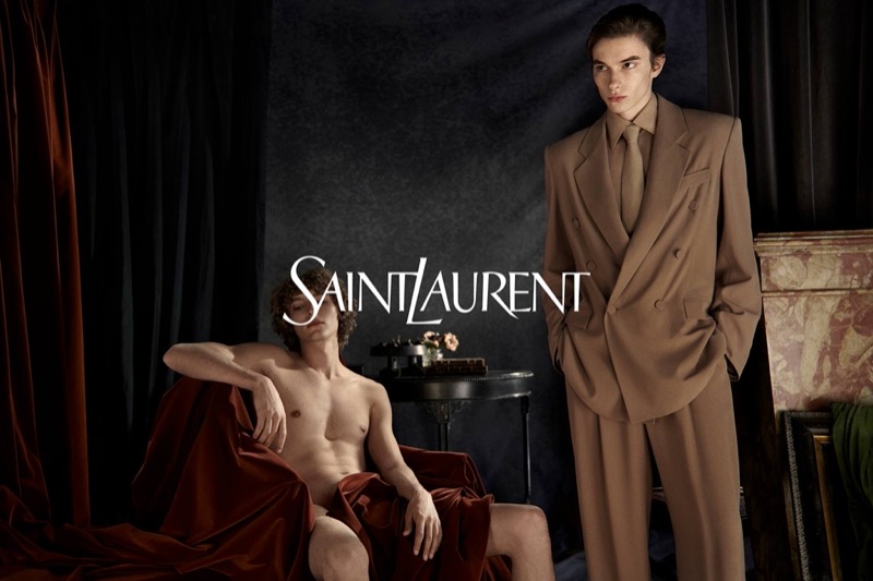 Thomas LeMaigre dons a brown double-breasted suit, appearing alongside a barely clad Vassili Schneider in Saint Laurent’s winter 2024 campaign.