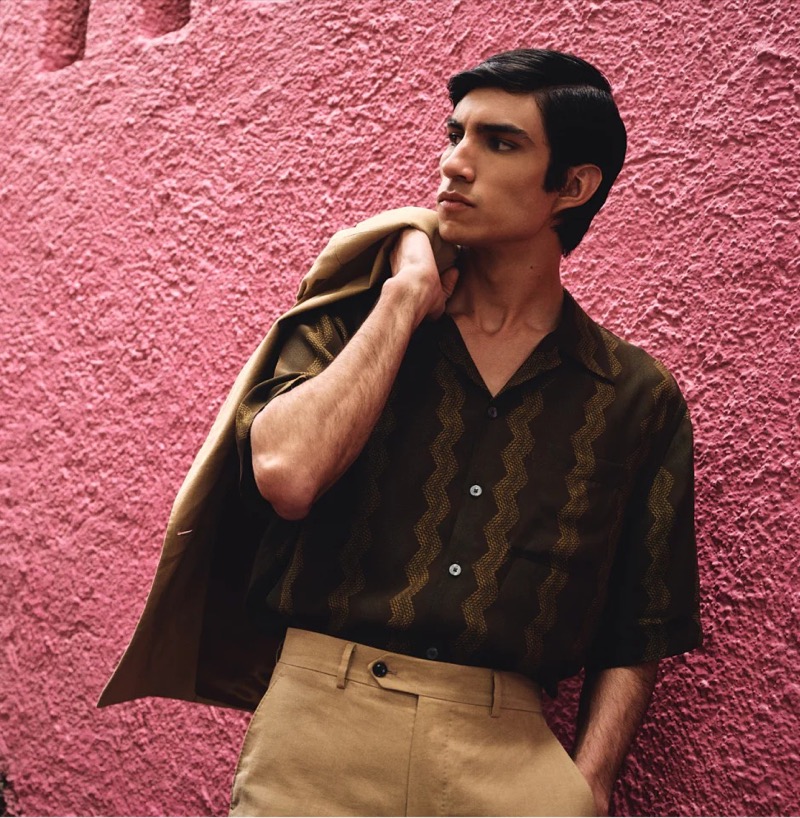 Exuding summer elegance, Duncan Yair showcases Todd Snyder Collection’s olive zigzag camp collar shirt. 