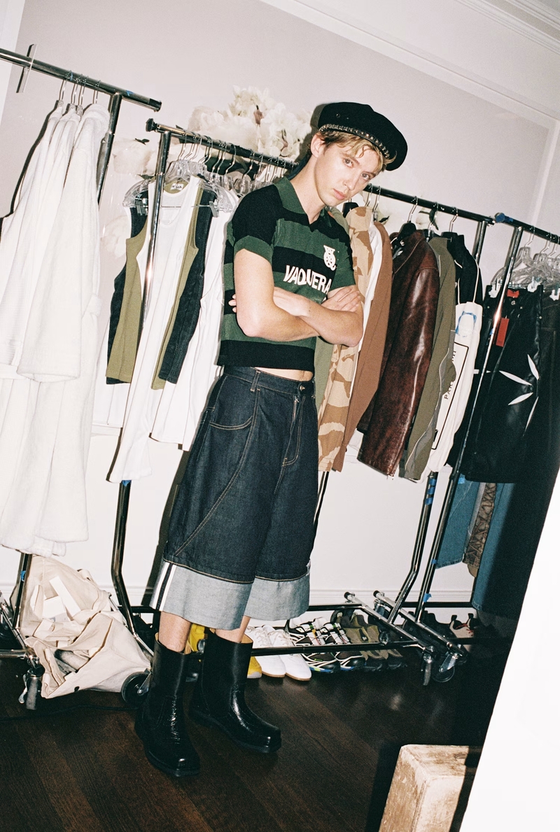 Embracing bold, modern style, Troye Sivan sports a Vaquera top and beret with Ader Error shorts and Soulland boots.