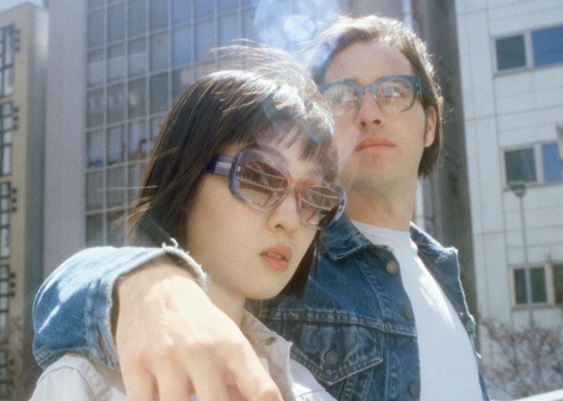 Warby Parker’s Sumner sunglasses and Rocco eyeglasses shine against an urban backdrop. 