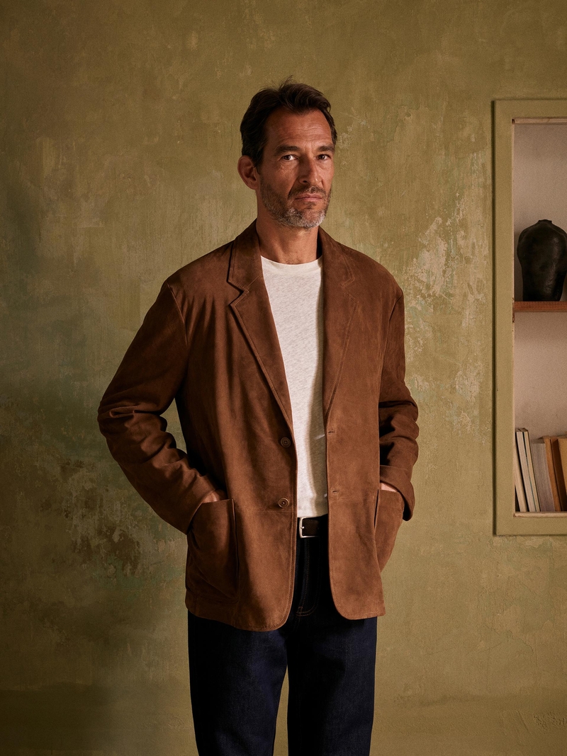 Roman Seefeldt dons a classic brown suede blazers from the Zara Origins summer 2024 collection.