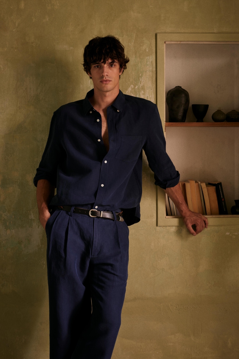 Francesco Ruggiero wears a navy ensemble from the Zara Origins summer 2024 collection.