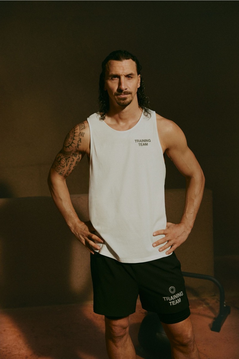 Zlatan Ibrahimović models a white “Training Team” tank top and black shorts from H&M Move’s latest collection.