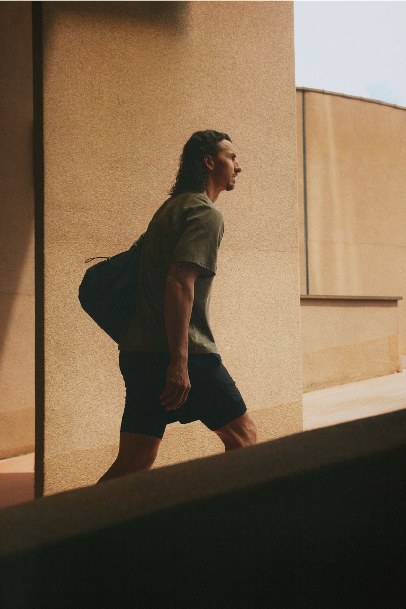 Zlatan Ibrahimović strides confidently in H&M Move’s t-shirt and black shorts.