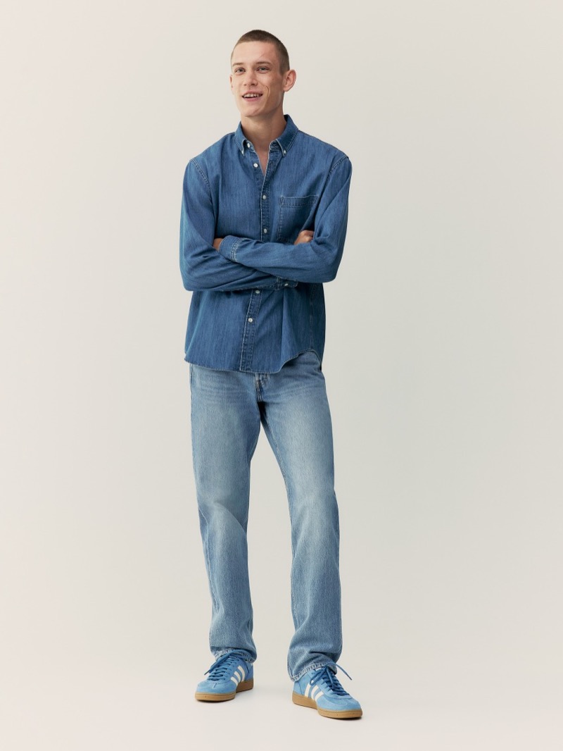 ARKET showcases a double denim fit with a denim shirt and jeans.