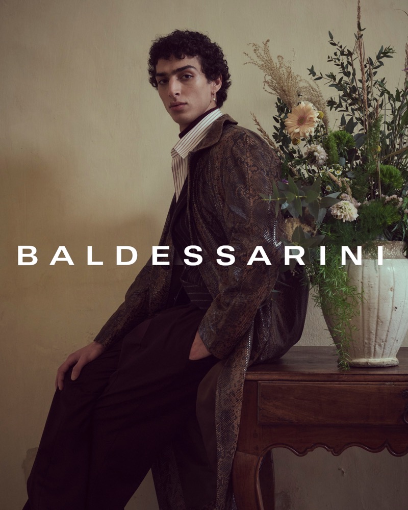 Qaher Harhash stars in Baldessarini’s fall-winter 2024 campaign, donning a reptile print coat with classic tailoring. 