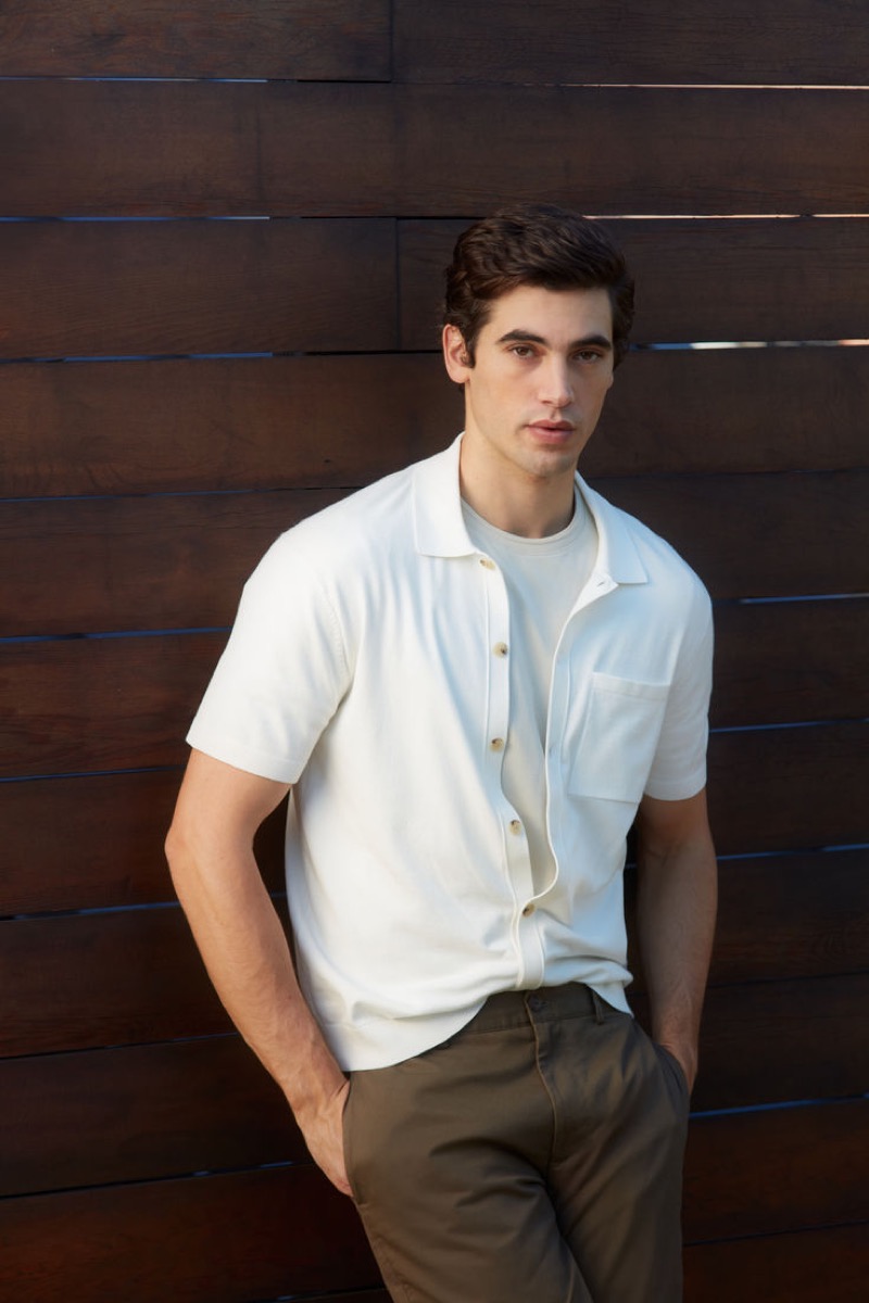 Sporting a smart-casual look by Club Monaco, Marco Bellotti dons a short-sleeve tech button-down shirt. 