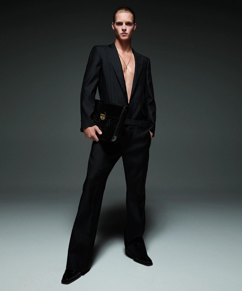 Model Luke Champion goes formal for the Dsquared2 fall-winter 2024 campaign.