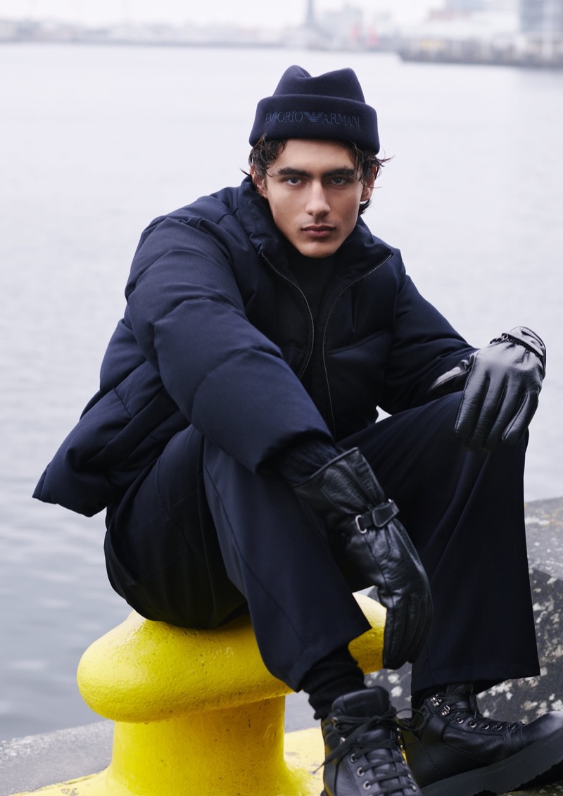 Akbar Shamji sports a navy puffer jacket by Emporio Armani. 