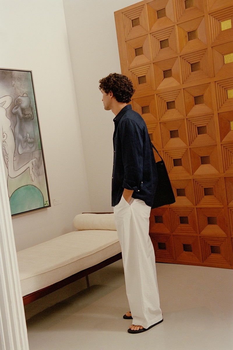 Francisco Henriques dons a linen shirt with pleated pants at the R & Company Gallery.