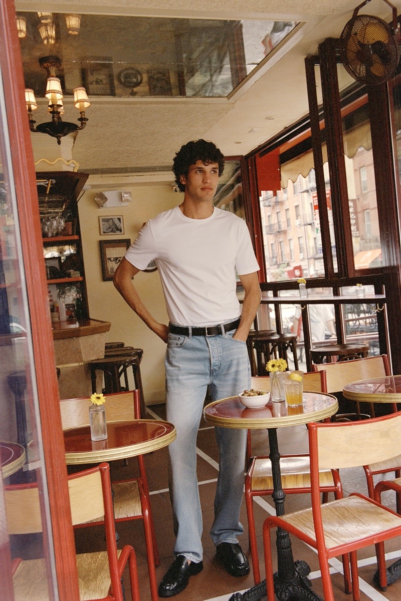 Embracing a clean, simple style, Francisco Henriques sports a white T-shirt with jeans.