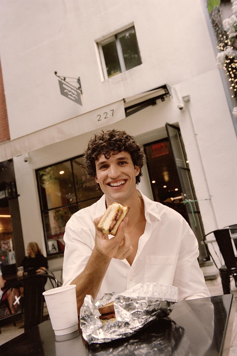 Donning a crisp white Zara shirt, Francisco Henriques grabs a bite at Rigor Hill Market.