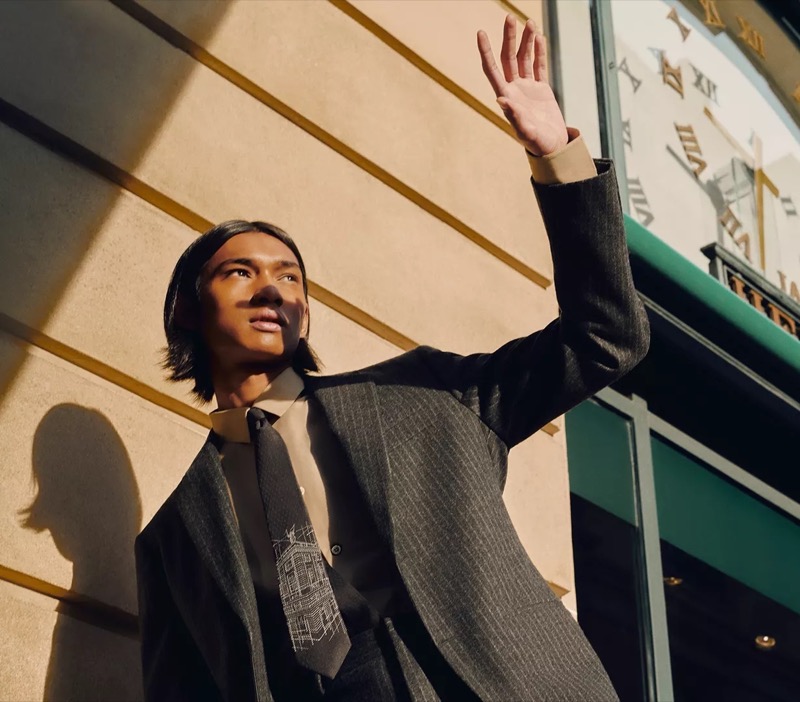 Ridzman Zidaine wears a pinstripe suit with a unique Hermès tie.