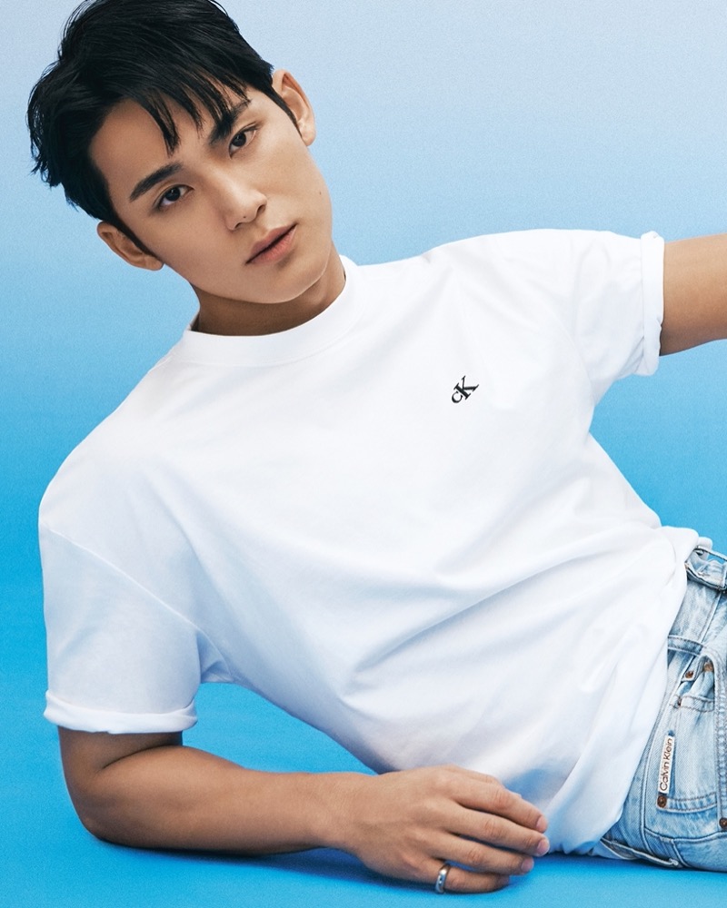 MINGYU sports an archival logo T-shirt with jeans for Calvin Klein’s fall 2024 campaign.